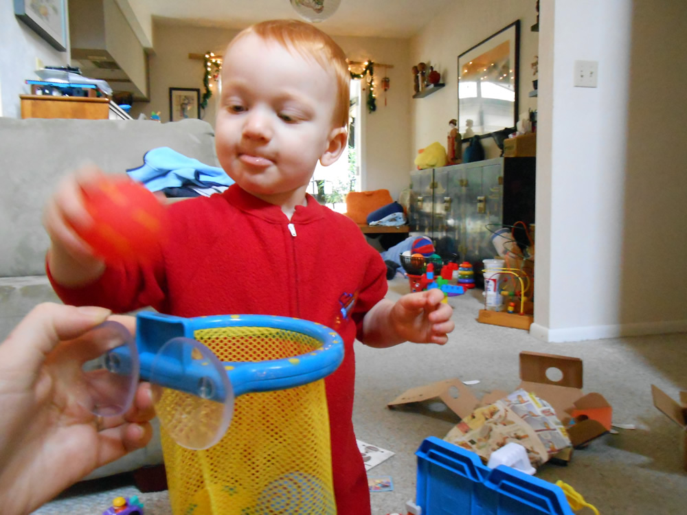 The bath ball net has come in handy to persuade him bath time can still be fun.